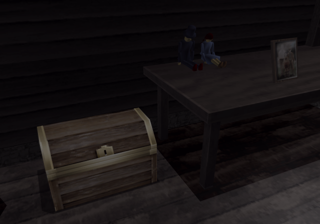 An open chest and a framed picture sit inside the beach house.
